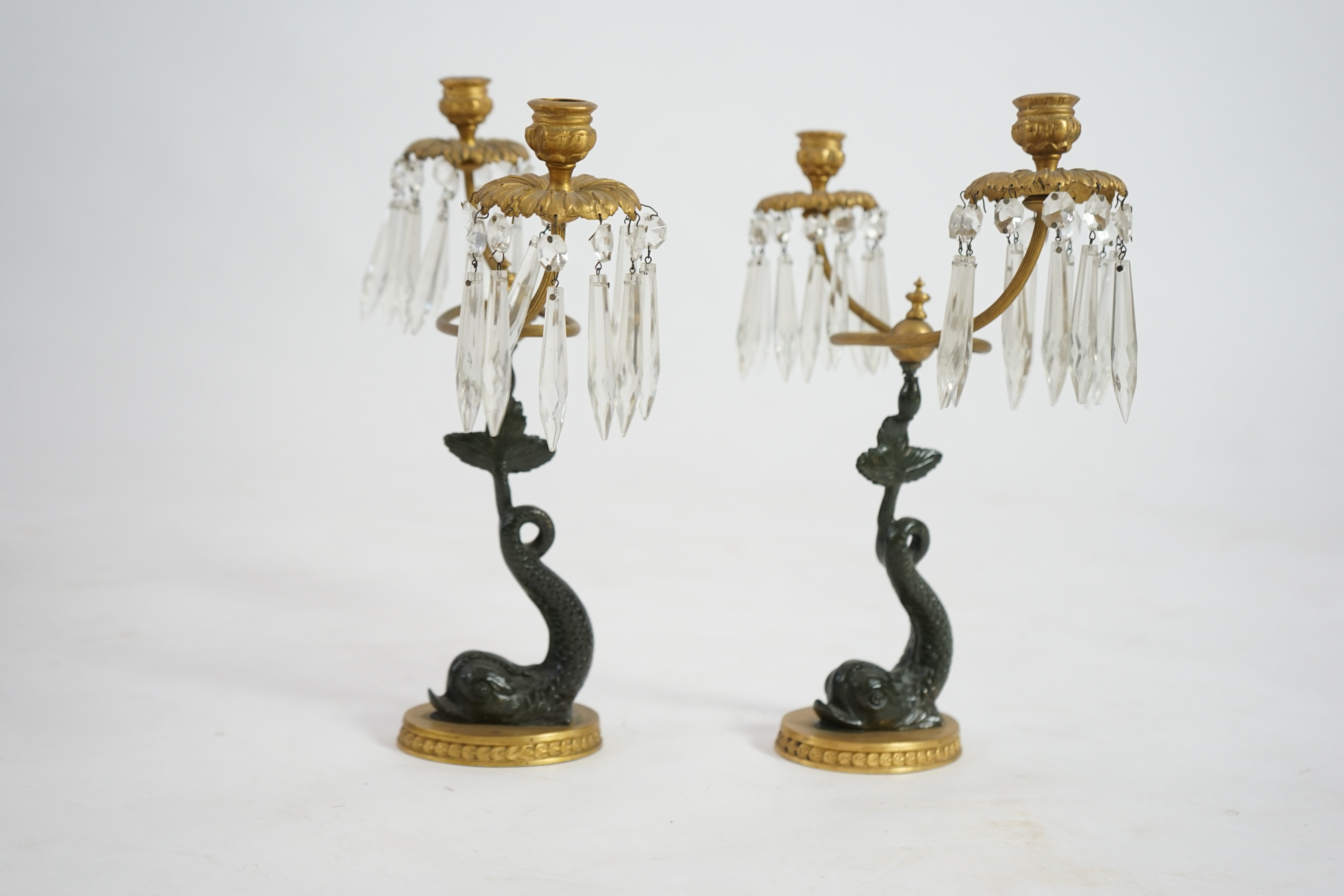 A pair of 19th century bronze and ormolu twin sconce candelabra